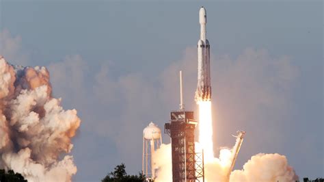 falcon heavy spacexs giant rocket launches  orbit  sticks  landings   york