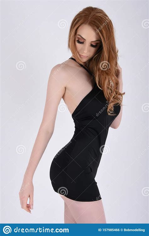 Sexy Busty Redhead In A Short Tight Black Party Dress