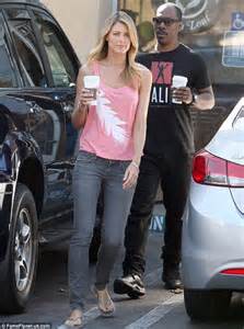 eddie murphy gives a thumb up as he takes his pretty blonde girlfriend paige butcher on their