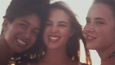 closeup of carefree teen girls making funny faces and