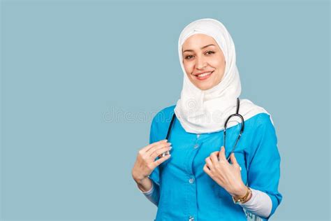 Portrait Of A Friendly Muslim Doctor Or Nurse Woman In Hijab With A