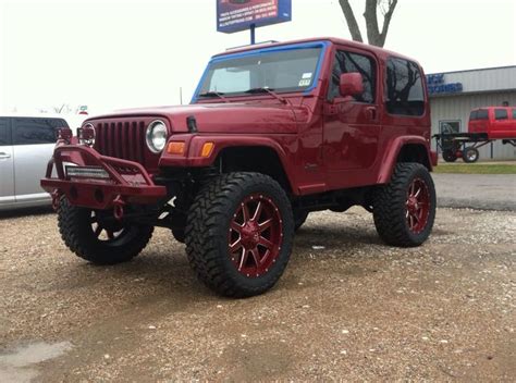 red jeep parked  front   building