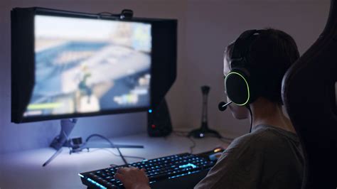child gaming  headset seated  computer stock footage sbv