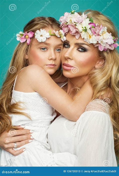 Glamour Portrait Of Mother And Beautiful Daughter In Wreath Stock Image