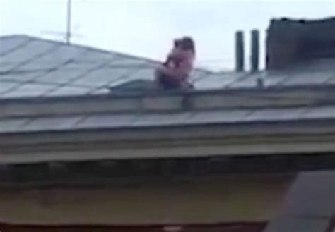 raunchy couple risk their lives to have public sex on sloped rooftop of