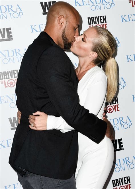 kendra wilkinson flaunts insane cleavage shows off major pda with