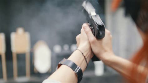 woman shooting  pistol gun  shooting stock footage sbv
