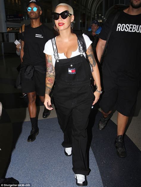 amber rose sides with kanye west amid his feud with taylor