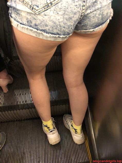 skinny ass in denim mini shorts hot and long legs subway