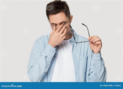 Stressed Man Take Off Glasses Massaging Eyes Suffering From Headache