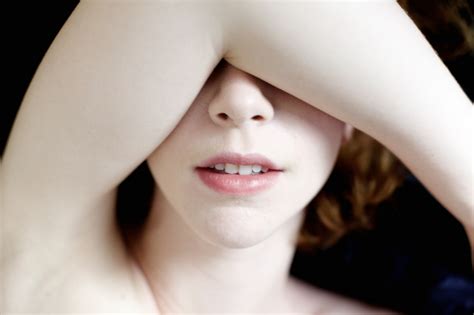 Women Pale Open Mouth Covered Eyes Lying On Back