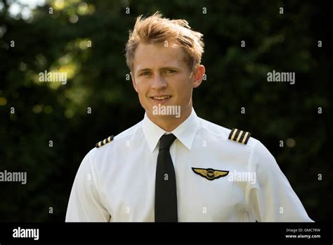 portrait   young male airline pilot  uniform stock photo alamy