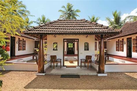 traditional kerala house  red trim  wooden doors