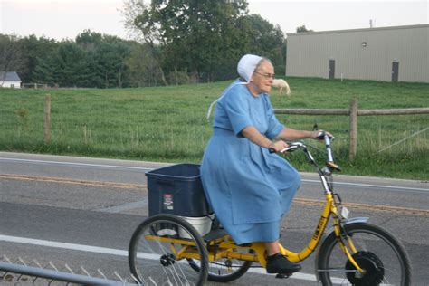 amish lady riding  bike fredricksburg ohio amish family holmes county ohio holmes county