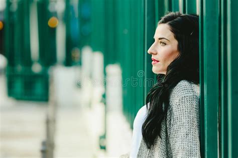 Portrait Of A Beautiful Mature Brunette Woman On The Street Looking
