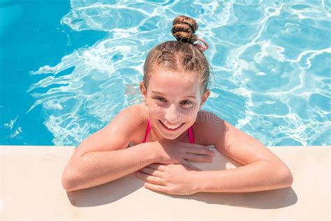 teen girl swimming pool squinting  eyes stock   royalty  stock