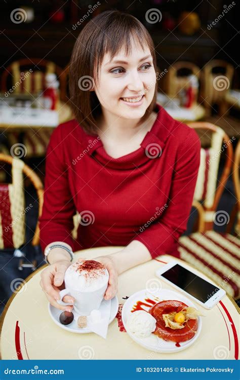 french woman drinking coffee in parisian outdoor cafe stock image