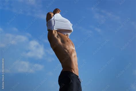 Gay Body Concept Sexy Muscular Man Undressing On Sky Background Guy