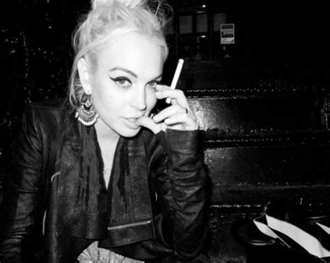 not a fan of her haha but i like how dark this photo is with the leather jacket and cigarette favs