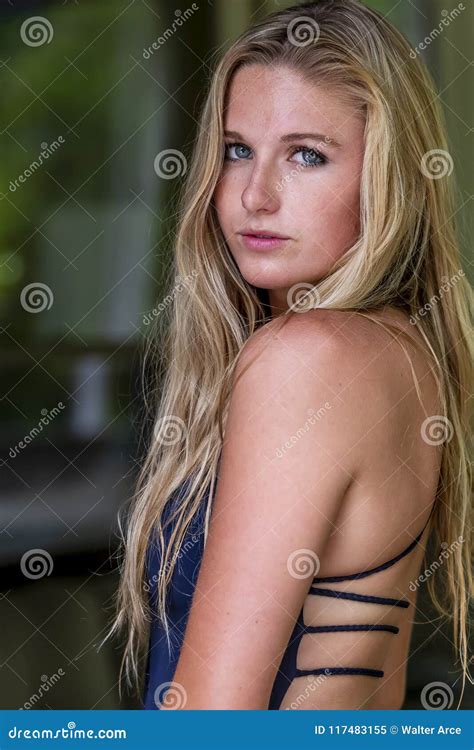 Beautiful Swimsuit Blonde College Coed Poses In A Home Environment