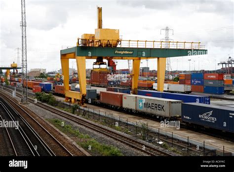 rail mounted crane loading containers  rail carriages  truck stock photo  alamy