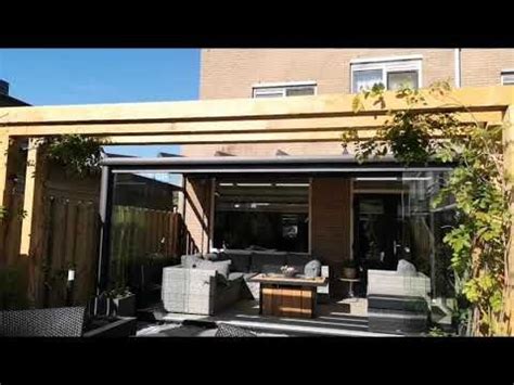 outdoor living area  patio furniture  wooden pergolated roof overhangs