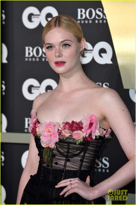 elle fanning wows in black sheer dress at gq men of the year awards
