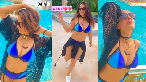 ameesha patel h0t look in blue bikini enjoying by the pool in delhi
