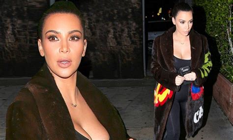 kim kardashian confidently wears plunging bodysuit and a big fur coat