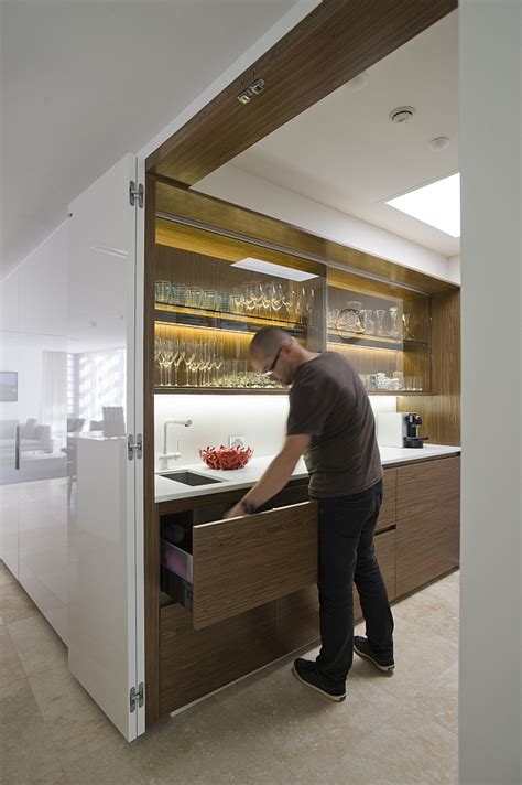 small space solutions hidden kitchen  minosa design