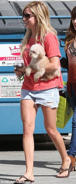 ashley tisdale parades her toned and tanned legs in daisy dukes as she