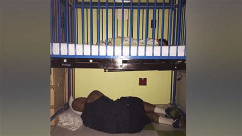 father falls asleep under sick son s crib at the hospital in heartwarming photo abc news