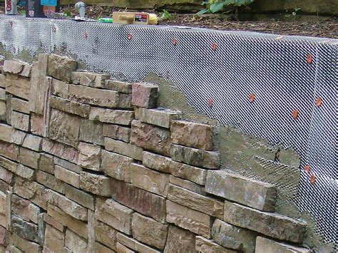 cover  stone wall stone walls garden railroad tie retaining wall diy stone wall
