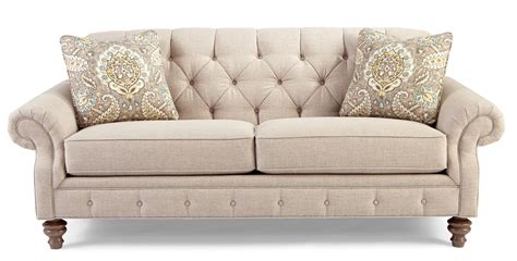 traditional button tufted sofa  wide flared arms