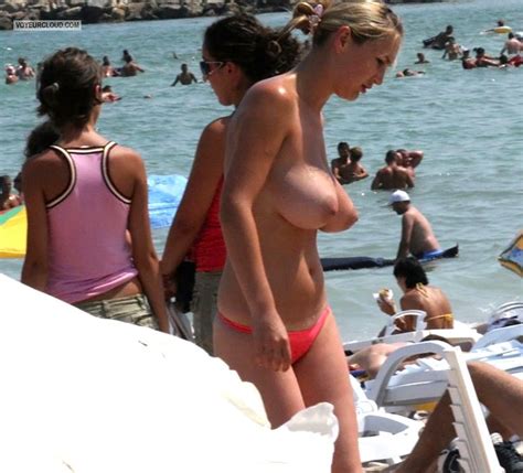 torpedo tits on topless beach voyeur photos
