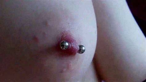 Teasing Firm Perky Nipples With Piercing In Closeup
