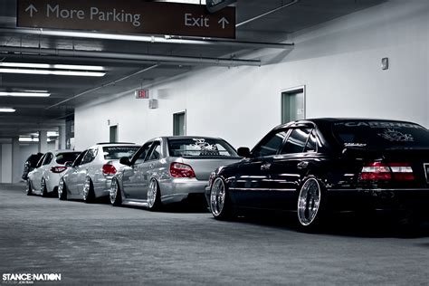 cars parked   parking garages    black  chrome rims