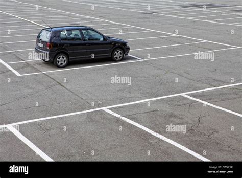 single car parked   large parking lot concept image parking spaces  germany europe