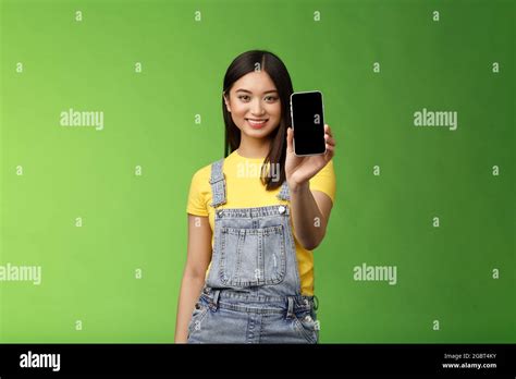 confident assertive good looking female asian introduce smartphone app