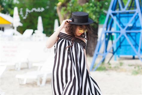 Luxury Travel Woman In Black And White Beachwear Walking Taking A
