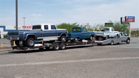 ford   pulling  flatbed trailer