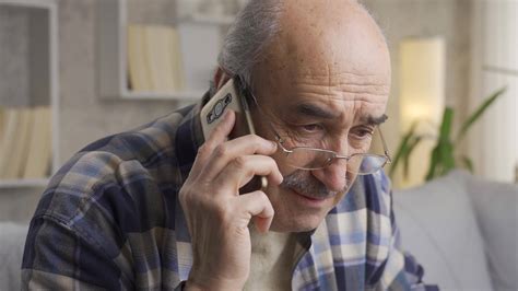 The Old Man Gets Bad News And Gets Upset While Talking On The Phone