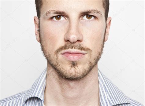 young mans face  expression stock photo  ctommasolizzul