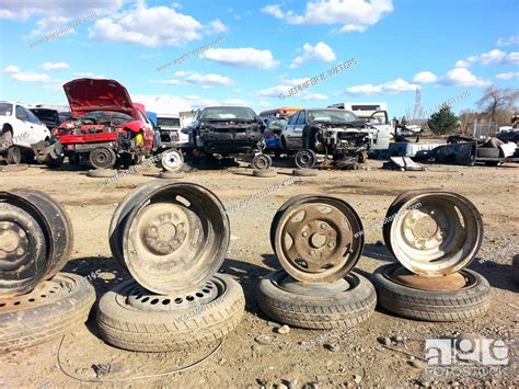welded wheels  hold  damaged vehicles   scrap yard stock