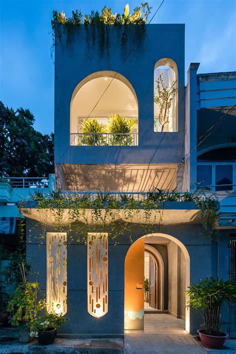 ad architects adds small arches   vietnamese house  create light filled interiors