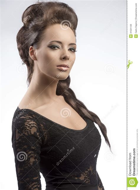 brunette girl with creative hair style and cute make up stock image