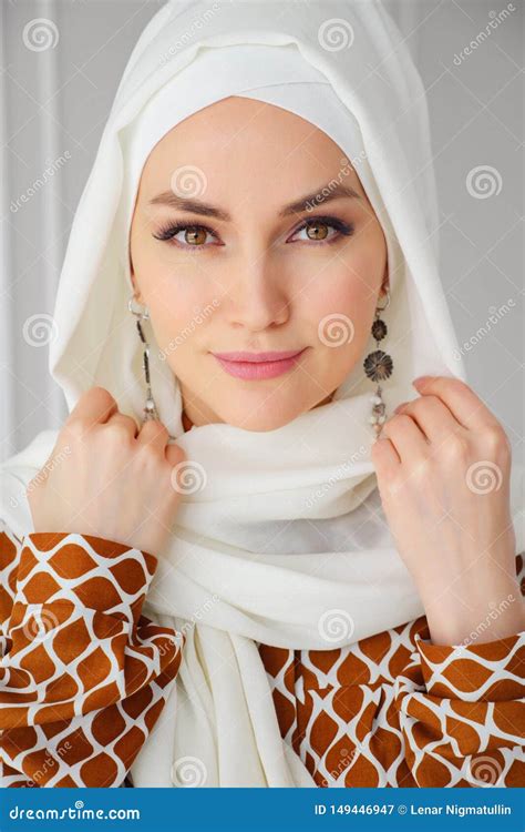 Woman In Hijab Hugging Her Handsome Husband With Laptop Royalty Free