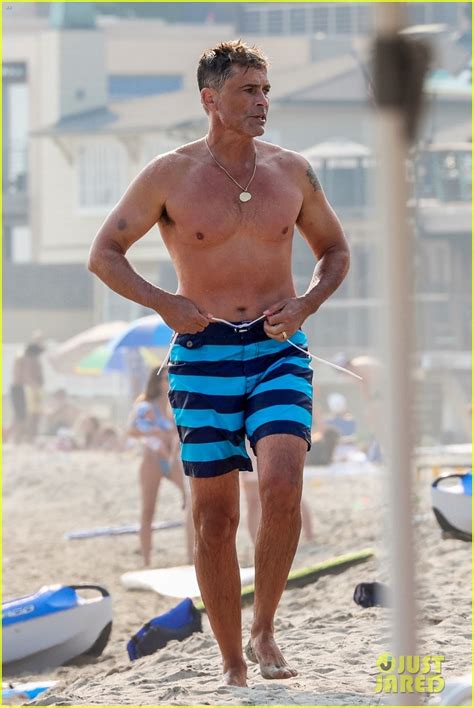 full sized photo of rob lowe shows of fit shirtless figure beach 21