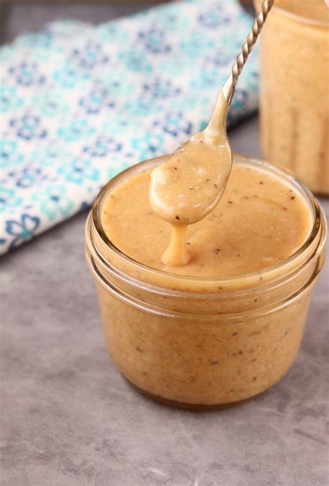 spoon full  peanut butter  top   jar     background