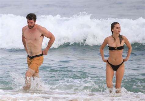 liam hemsworth shows off his ripped beach bod during a